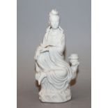 A 20TH CENTURY CHINESE BLANC-DE-CHINE FIGURE OF GUANYIN, seated upon a rocky plinth, 6.1in high.