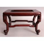 A GOOD QUALITY 19TH CENTURY CHINESE CARVED HARDWOOD RECTANGULAR STAND, supported on scroll end