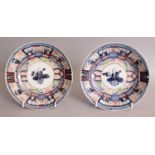 A PAIR OF 17TH/18TH CENTURY JAPANESE ARITA PORCELAIN DISHES, each unusually painted in a Chinese