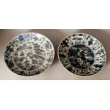 TWO SIMILAR LARGE CHINESE WANLI PERIOD KRAAK PORCELAIN DISHES, of saucer shape, one painted to its