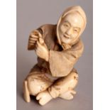 A GOOD QUALITY SIGNED JAPANESE MEIJI PERIOD IVORY OKIMONO OF A SEATED MAN, his hands pressed