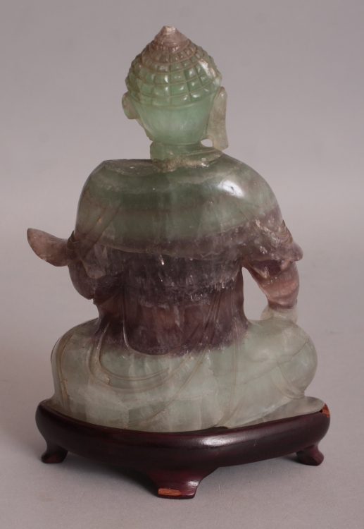 A 20TH CENTURY CHINESE FLUORITE CRYSTAL CARVING OF BUDDHA, together with a fitted wood stand, the - Image 3 of 8