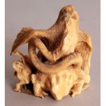 A GOOD QUALITY JAPANESE MEIJI PERIOD IVORY OKIMONO, well carved in the form of a hawk attacking a