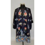 A GOOD 19TH/20TH CENTURY CHINESE BLUE GROUND SILK ROBE, decorated in satin stitch with butterflies