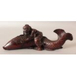 A JAPANESE MEIJI PERIOD WOOD OKIMONO OF EBISU & THE CARP, the deity borne on the carp's back, 8.