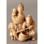 A GOOD QUALITY JAPANESE MEIJI PERIOD IVORY OKIMONO OF A FARMER & HIS FAMILY, the farmer squatting