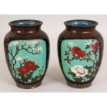 A PAIR OF JAPANESE MEIJI PERIOD CLOISONNE VASES, decorated with panels of foliage, 5.9in high.