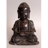A GOOD 16TH CENTURY CHINESE MING DYNASTY BRONZE FIGURE OF BUDDHA, seated in dhyanasana, the hems