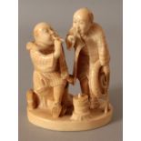 A SIGNED JAPANESE MEIJI PERIOD IVORY OKIMONO OF TWO COMPANIONS, one man seated, the other