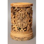A GOOD QUALITY 19TH CENTURY CHINESE CANTON IVORY BRUSHPOT, the sides pierced and carved in relief