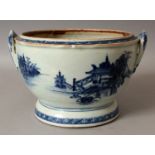 AN 18TH CENTURY CHINESE QIANLONG PERIOD BLUE & WHITE CIRCULAR SECTION TUREEN BASE, painted with
