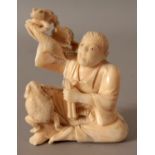 A JAPANESE MEIJI PERIOD IVORY OKIMONO OF GAMMA SENNIN, seated and in the company of three toads, 2.