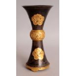 A GOOD QUALITY CHINESE GILT BRONZE BEAKER VASE, decorated with relief cast ruyi panels of foliage,