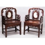 A GOOD PAIR OF EARLY 20TH CENTURY CHINESE CARVED HARDWOOD ARMCHAIRS, each with a hardwood framed