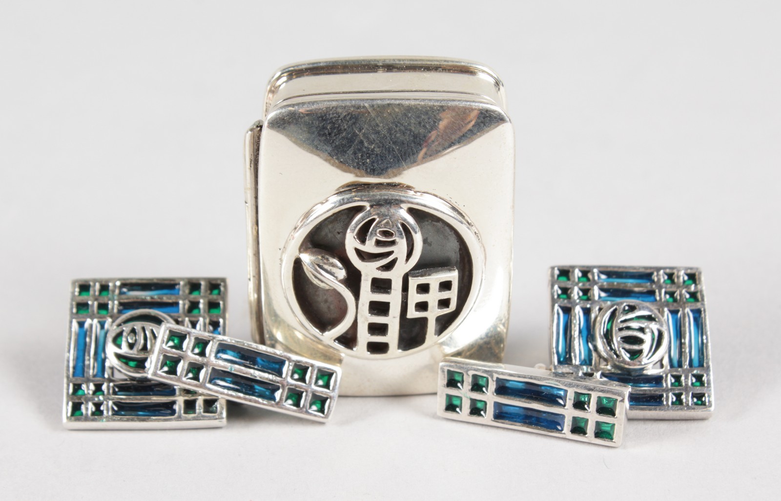 A PAIR OF SILVER AND ENAMEL CELTIC CUFFLINKS AND PILL BOX.