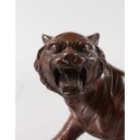 A JAPANESE BRONZE TIGER. 12ins long.