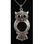 A SILVER OWL SPY GLASS on a silver chain.