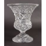 A HEAVY CUT GLASS THISTLE SHAPED FLOWER VASE. 10ins high.