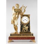 A SUPERB FRENCH EMPIRE GILT BRONZE AND ROUGE MARBLE CLOCK, with eight-day movement striking on a