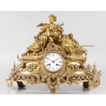 A 19TH CENTURY FRENCH ORMOLU CLOCK with white dial and eight-day movement, the case with a young man