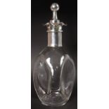 A GLASS DIMPLE DECANTER with plated mounts.