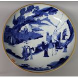 A LARGE CHINESE BLUE & WHITE PORCELAIN DISH, of saucer shape, decorated with the Eight Immortals