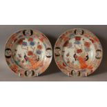 A PAIR OF JAPANESE HICHOZAN SHIMPO PORCELAIN SOUP PLATES, circa 1900, each painted with peacocks,