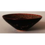 A CHINESE SOUTHERN SONG STYLE JIZHOU PAPERCUT CERAMIC BOWL, applied with a tortoiseshell glaze