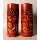 A MIRROR PAIR OF EARLY 20TH CENTURY CHINESE CARVED BAMBOO BRUSHPOTS, or hat stands, each carved with