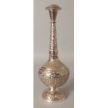 A 20TH CENTURY PERSIAN WHITE METAL ROSEWATER SPRINKLER, 10.75in high.