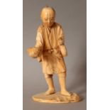 A SIGNED JAPANESE MEIJI PERIOD IVORY OKIMONO OF A FARMER HOLDING A QUAIL, the base with a red-