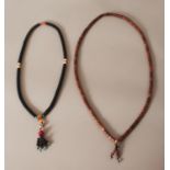 TWO CHINESE BEAD NECKLACES. (2)