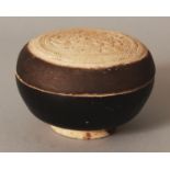 A 14TH CENTURY KHYMER CIRCULAR CERAMIC BOX & COVER, the centre of the cover unglazed and moulded