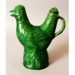 A CHINESE MING STYLE GREEN GLAZED POTTERY ROOSTER EWER & COVER, the base unglazed, 9in high.