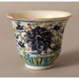 A 19TH CENTURY CHINESE UNDERGLAZE-BLUE & ENAMEL DECORATE4D PORCELAIN WINE CUP, painted with formal