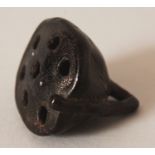 A JAPANESE CARVED WOOD NETSUKE OF A LOTUS POD, 1.4in wide & also 1.4in high.