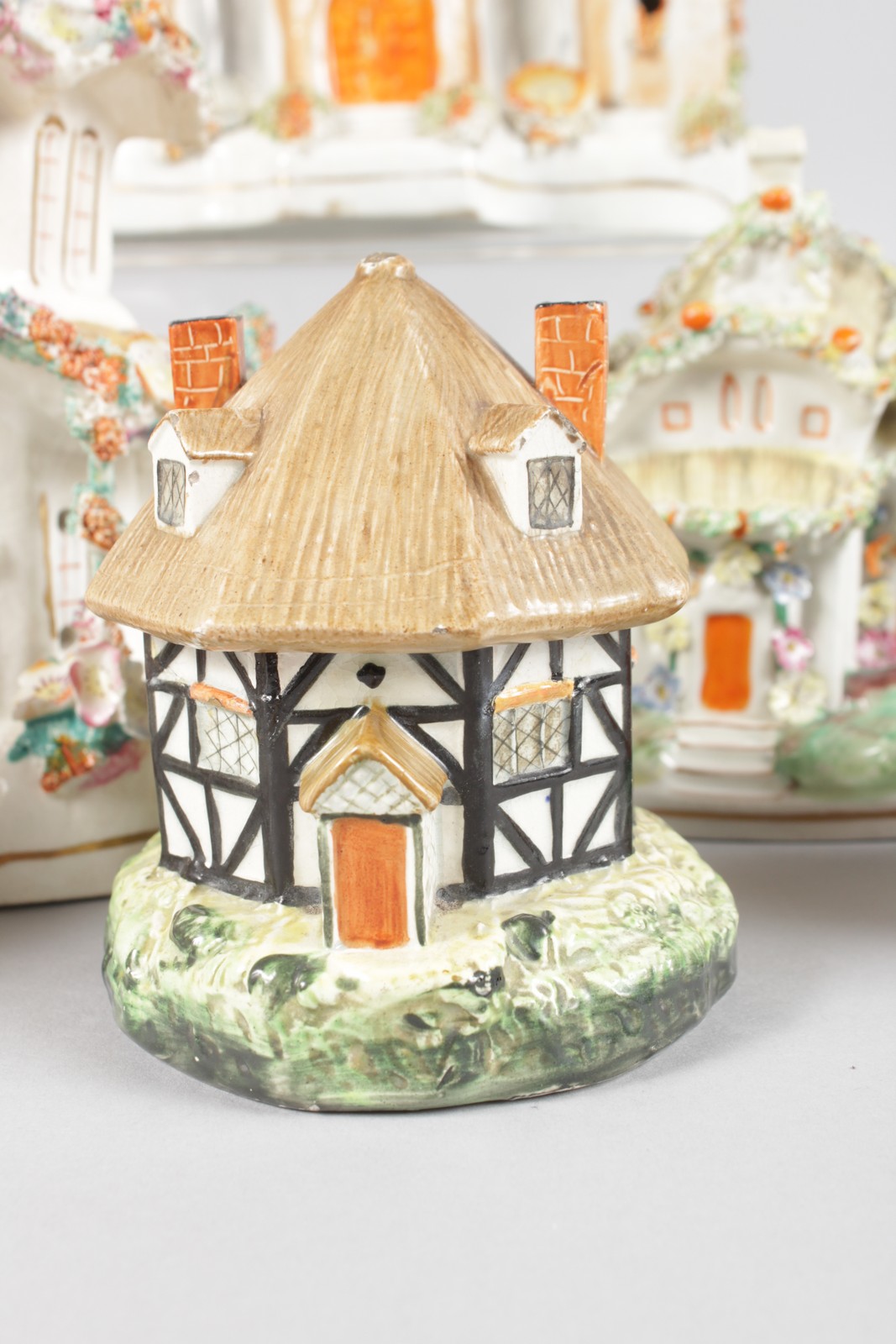 A SMALL COLLECTION OF NINE STAFFORDSHIRE COTTAGES AND PASTILLE BURNERS. - Image 4 of 10