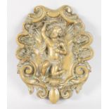 A CLASSICAL BRONZE SHAPED OVAL PLAQUE "CUPID". 5.5ins x 4ins.