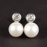 A SUPERB PAIR OF LARGE 15ML-PEARL AND 1CT DIAMOND EARRINGS by DAVID MORRIS.