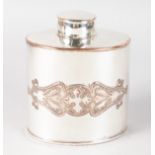 AN ART DECO PLATE OVAL TEA CADDY AND COVER.