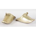 A PAIR OF 19TH CENTURY DUTCH BRASS STIRRUPS. 7ins long.