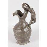 AN ART NOUVEAU BRONZED CLASSICAL EWER, the handles as a nude. 10ins high.