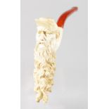 A GOOD MEERSCHAUM AND AMBER CIGARETTE HOLDER, carved head of a man with long flowing beard. 5ins