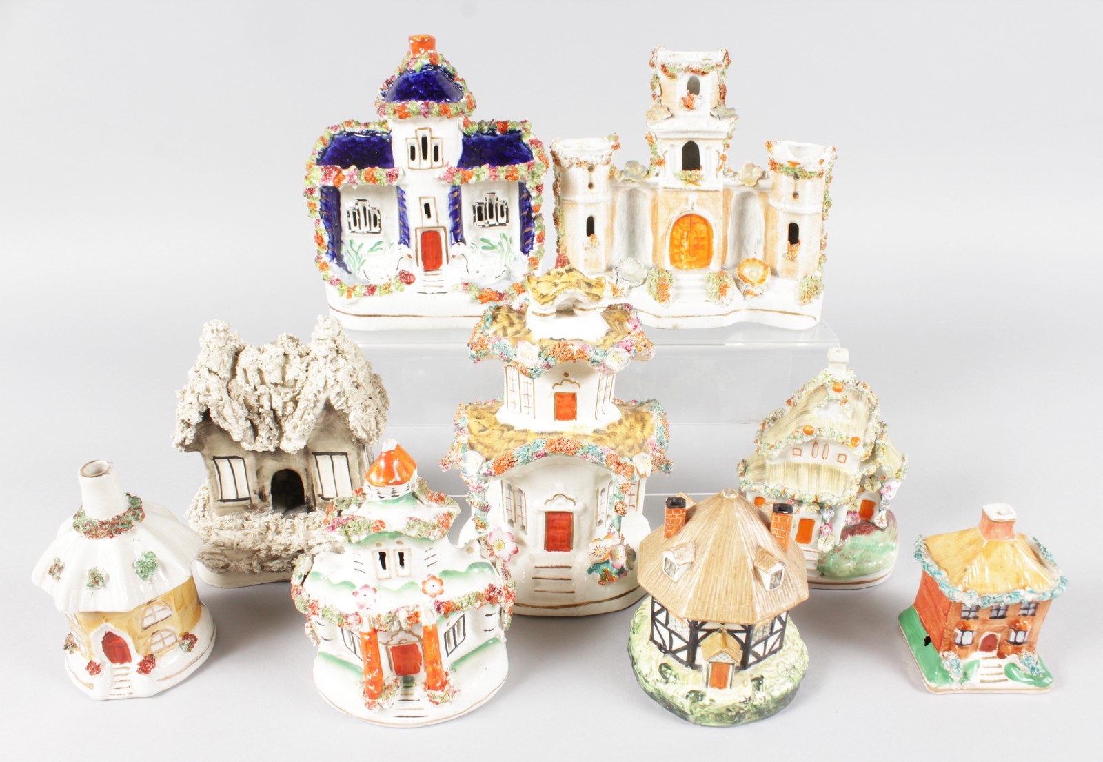 A SMALL COLLECTION OF NINE STAFFORDSHIRE COTTAGES AND PASTILLE BURNERS.