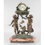 A 19TH CENTURY SPELTER FRENCH DRUM MANTLE CLOCK held aloft by a boy and girl standing on a