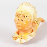 A VERY GOOD MEERSCHAUM AND AMBER PIPE, carved as the head of a young Negro boy with 9ct gold band.