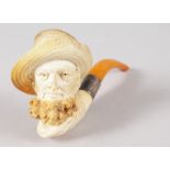 A GOOD MEERSCHAUM AND AMBER CIGARETTE PIPE, carved with the head of a man in a straw hat. 6ins long,