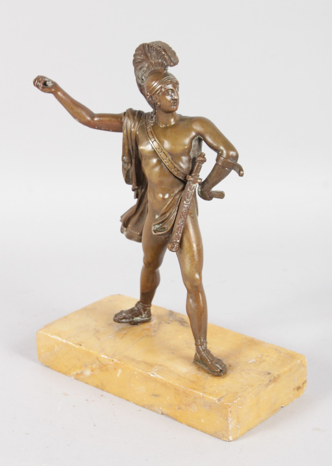 AFTER THE ANTIQUE A BRONZE GLADIATOR on a marble base. 7.5ins high.