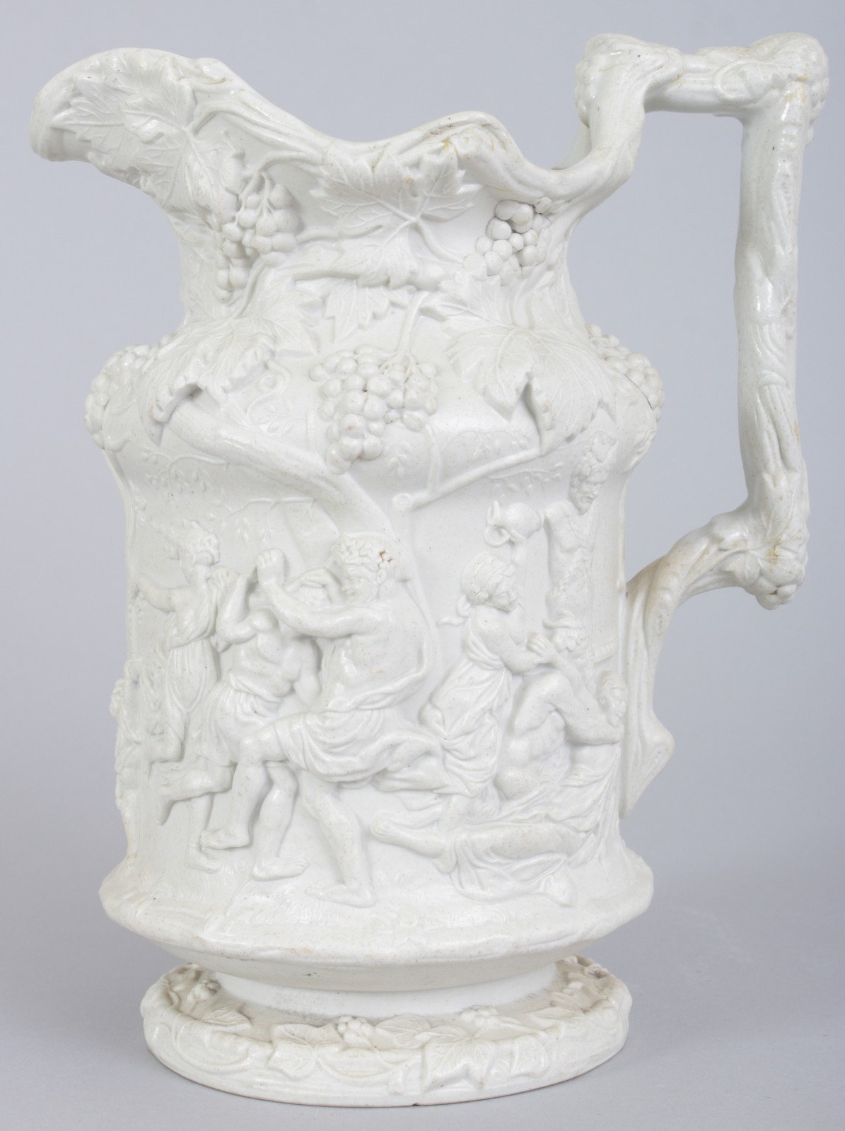 A CHARLES MEIGH 1844 STONEWARE RELIEF WINE PITCHER decorated with fruiting vines and Bacchus Greek