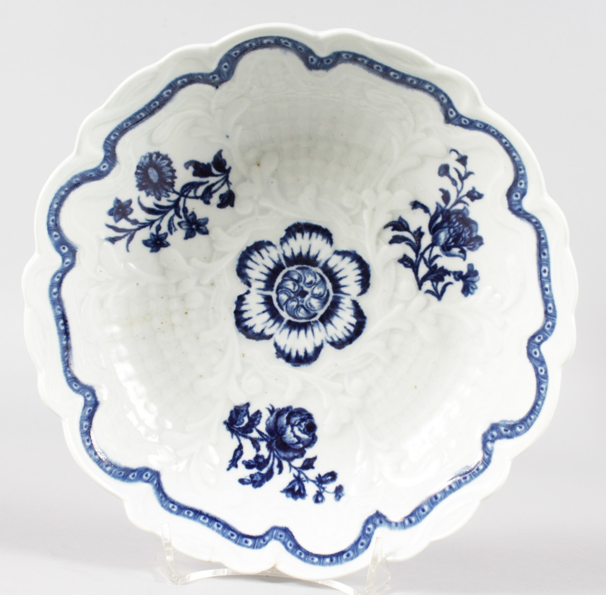 AN 18TH CENTURY WORCESTER JUNKET DISH with rare bamboo moulding decorated with underglaze blue